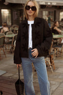 Veste matelassée femme noir brodée automne tendance Péplum